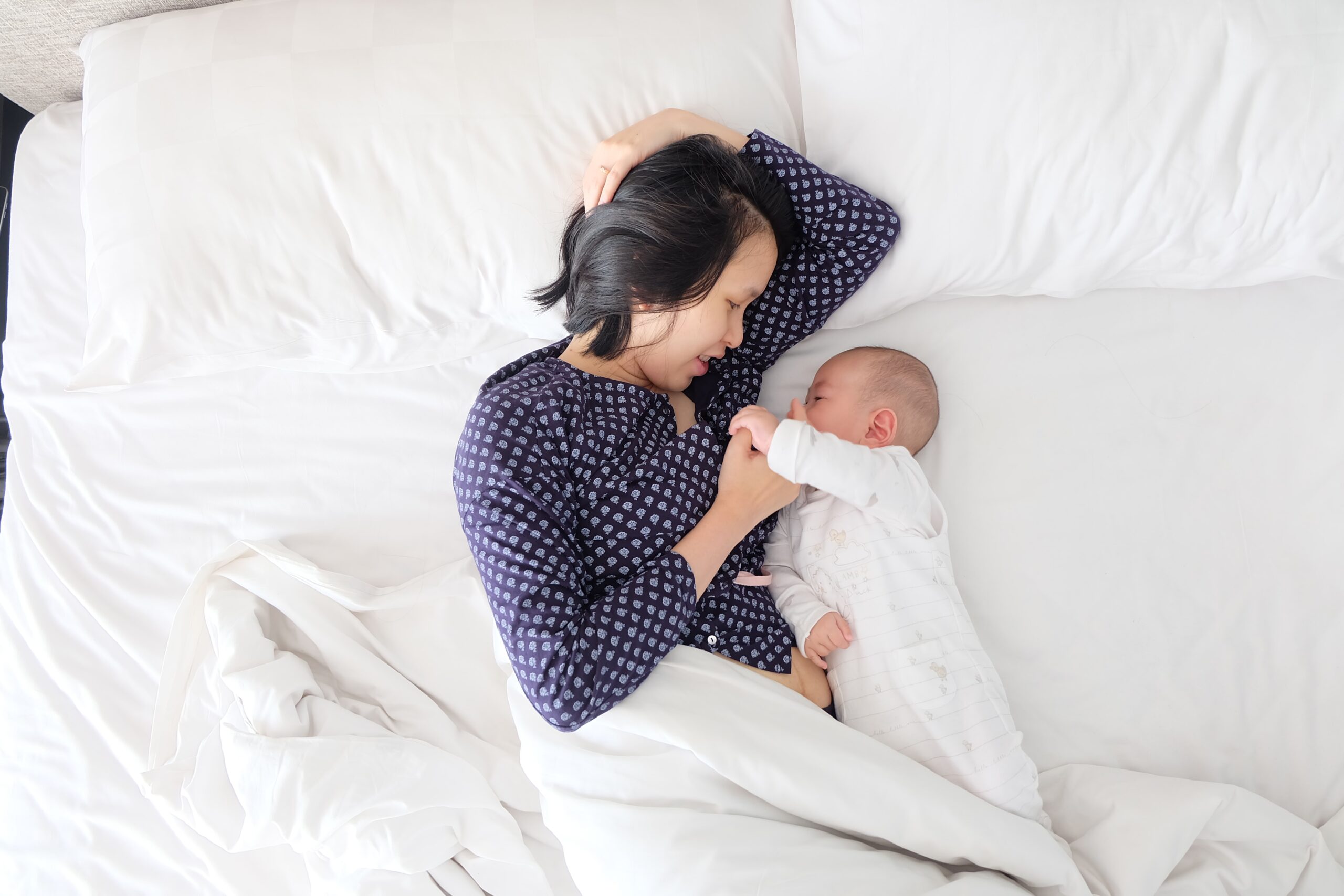 mom and baby in bed