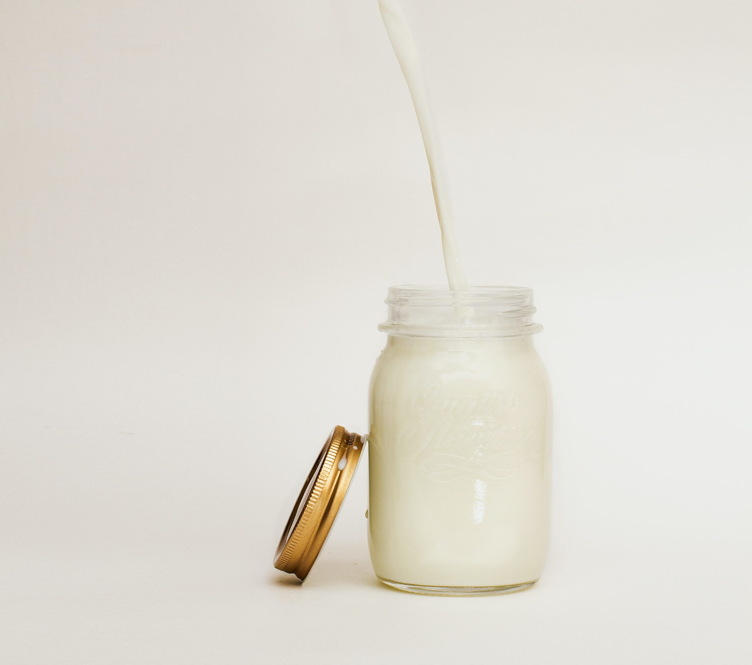 Milk being collected in a jar