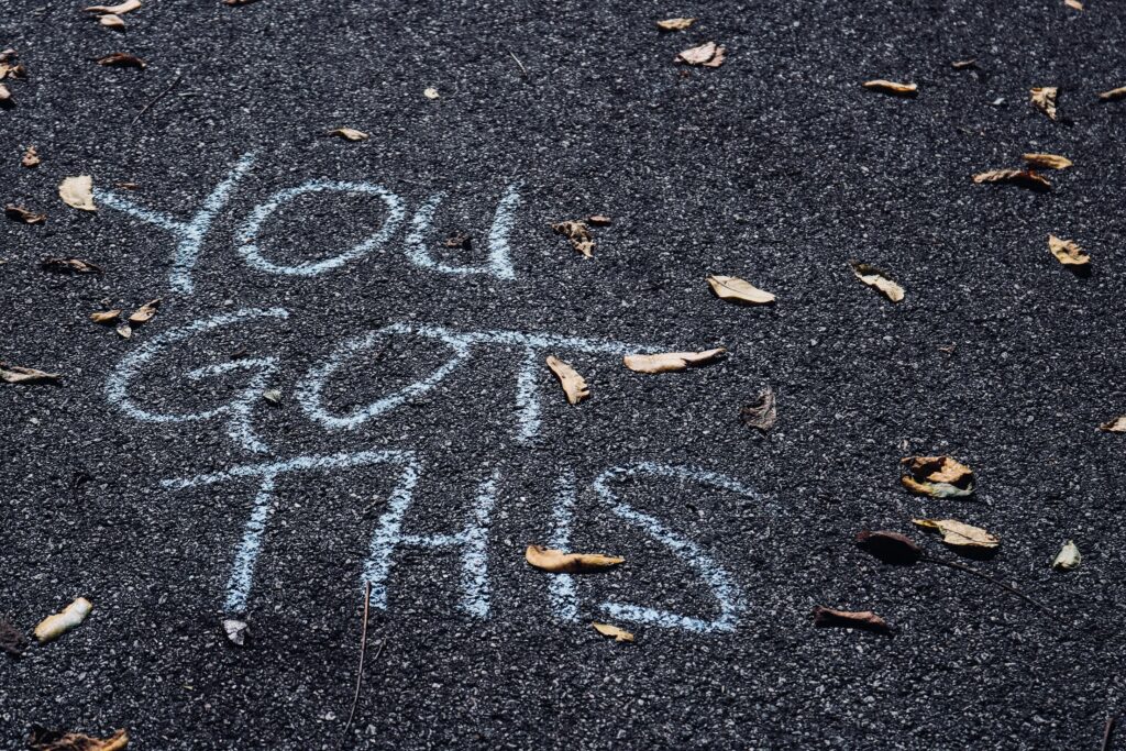 You got this written in chalk on black pavement covered in leaves
