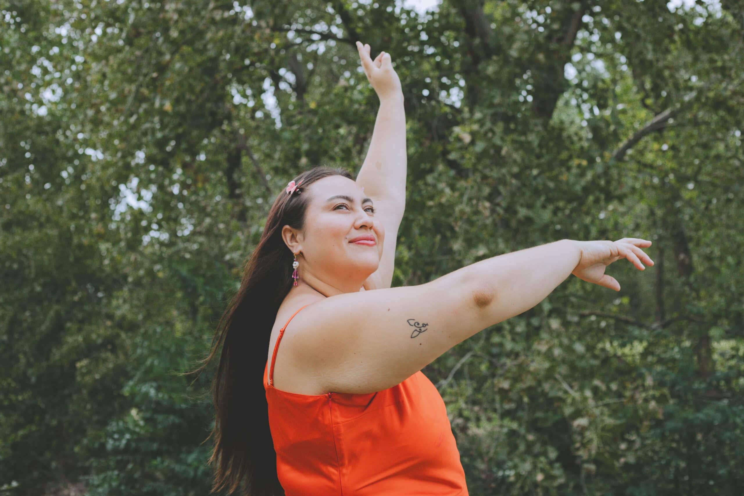 Woman looking peaceful and powerful in the woods